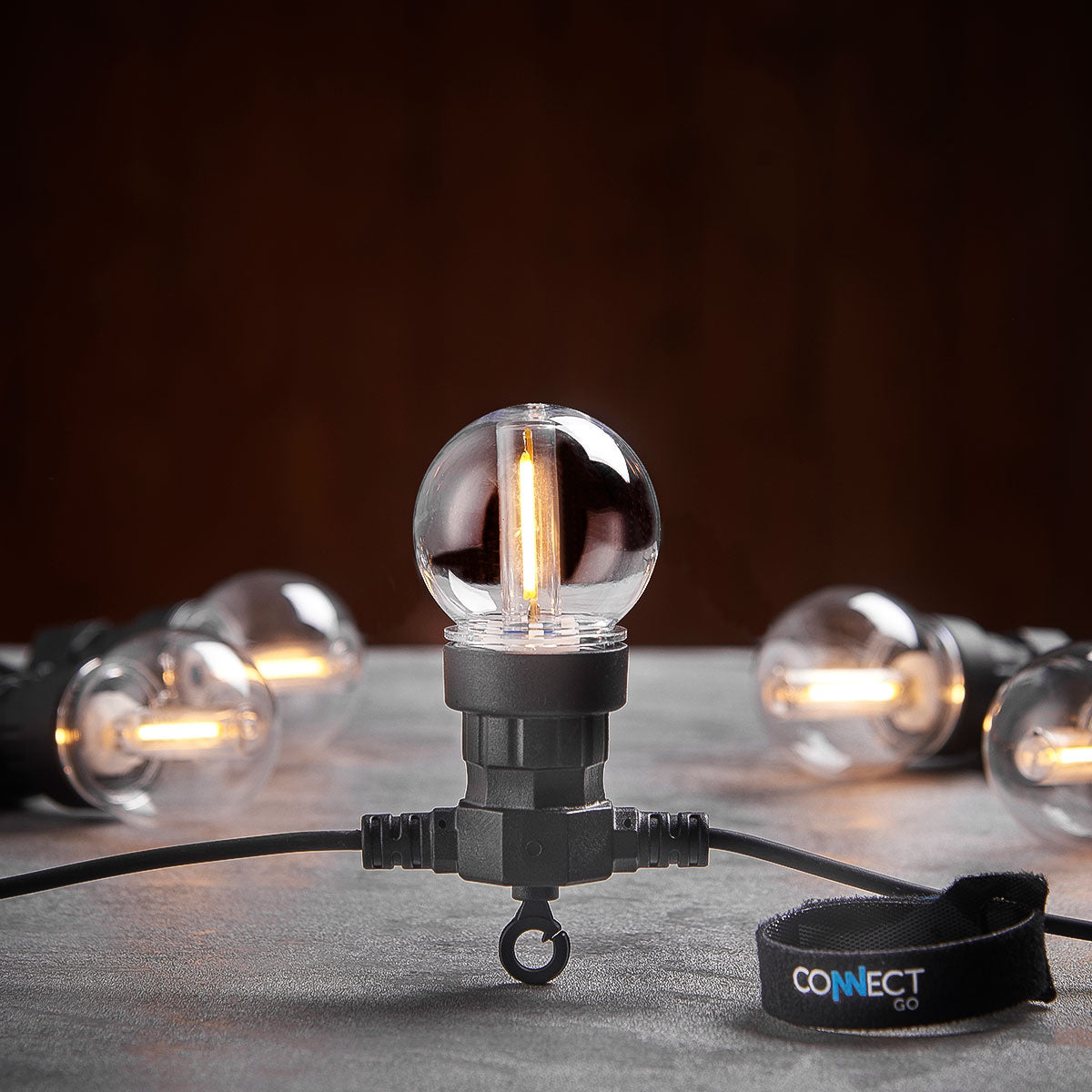 Connectable Festoon Lights with G50 Clear Filament Effect Bulbs on Black Rubber Cable