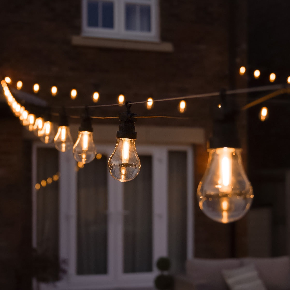 Connectable Festoon Lights with A60 Filament Effect Bulbs on Black Rubber Cable