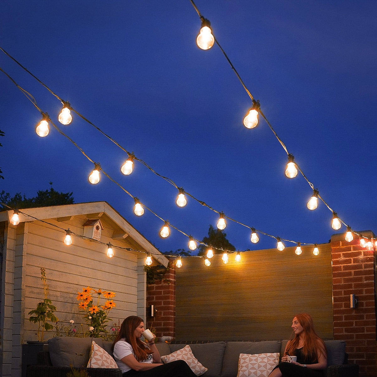 Connectable Festoon Lights with A60 Filament Effect Bulbs on Black Rubber Cable