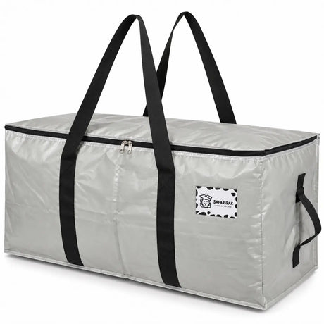 A silver-gray waterproof storage bag with black handles and trim, featuring a brand patch on the front, photographed on a white background.