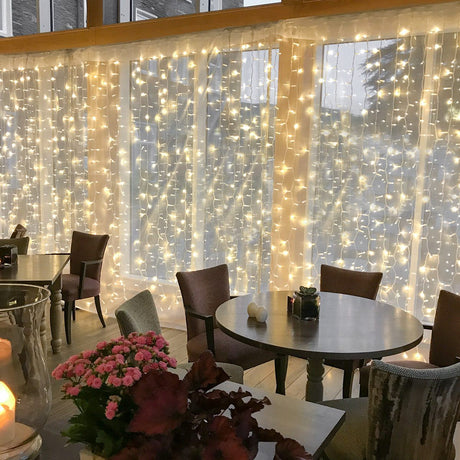 Connectable Warm White Curtain Lights on White Rubber Cable