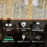 Connectable Warm White Curtain Lights on White Rubber Cable